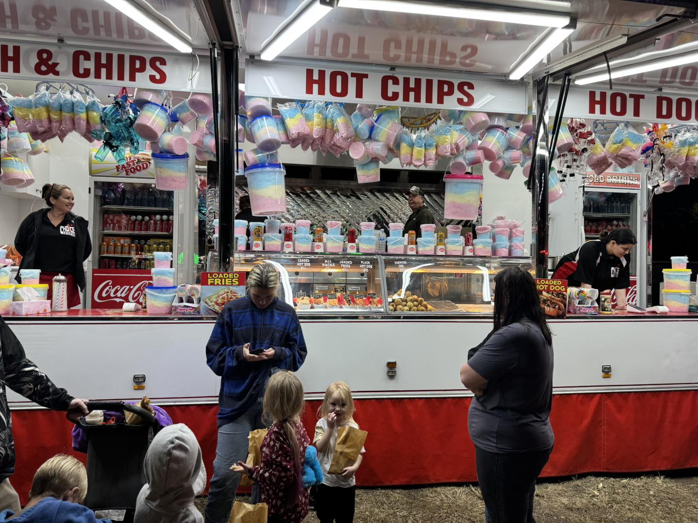 Carnival food stall with hot chips and fairy floss