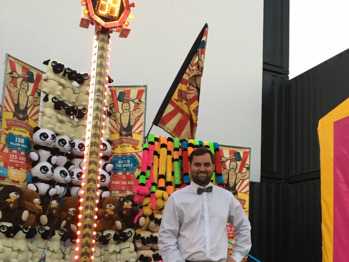 High Striker sideshow game with mallet and prize wall in Brisbane
