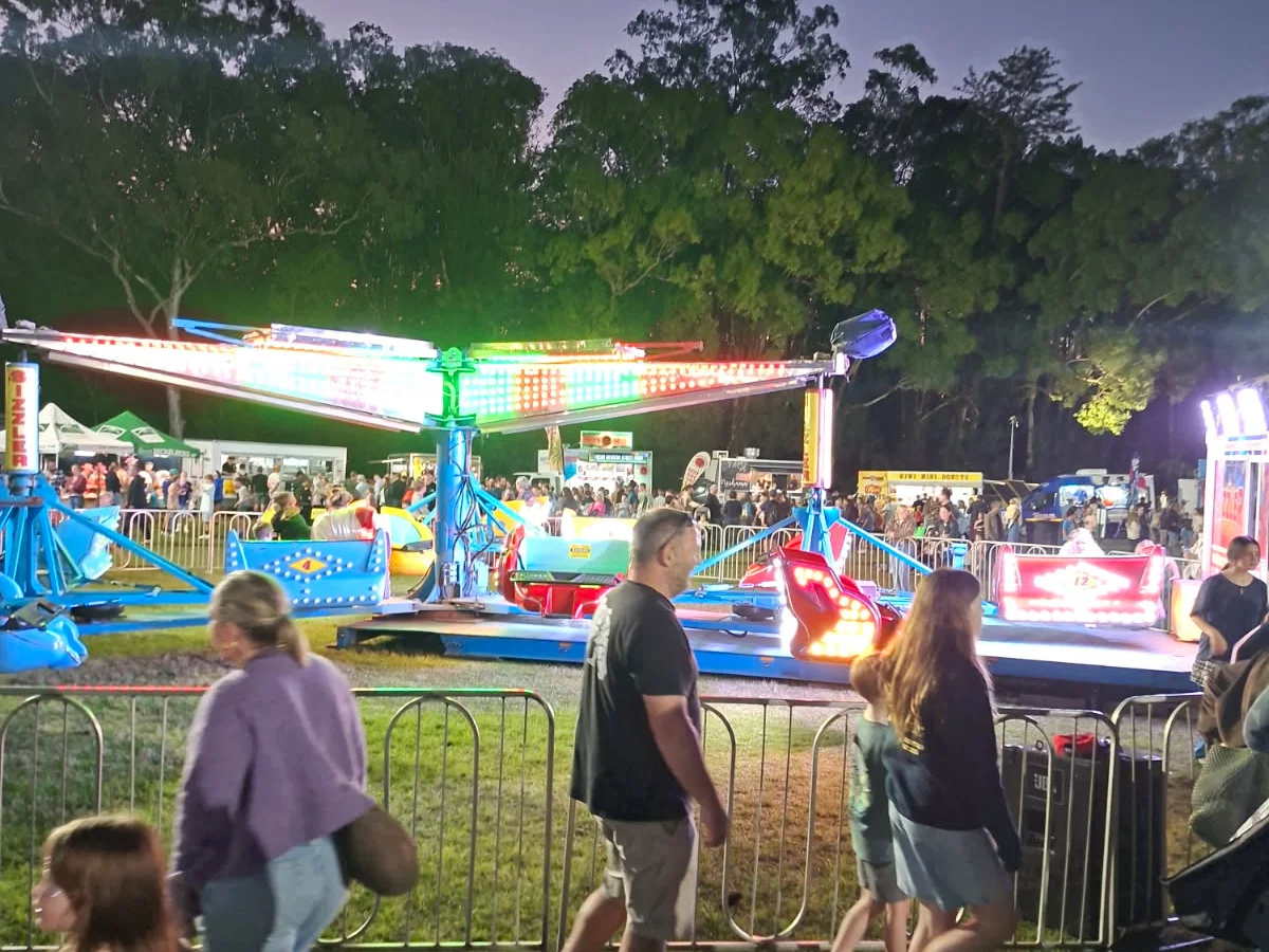Sizzler family amusement ride with LED lighting at a Brisbane event